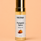 Bottle of Soft Pétalz Pumpkin Spice Body Oil on a peach background