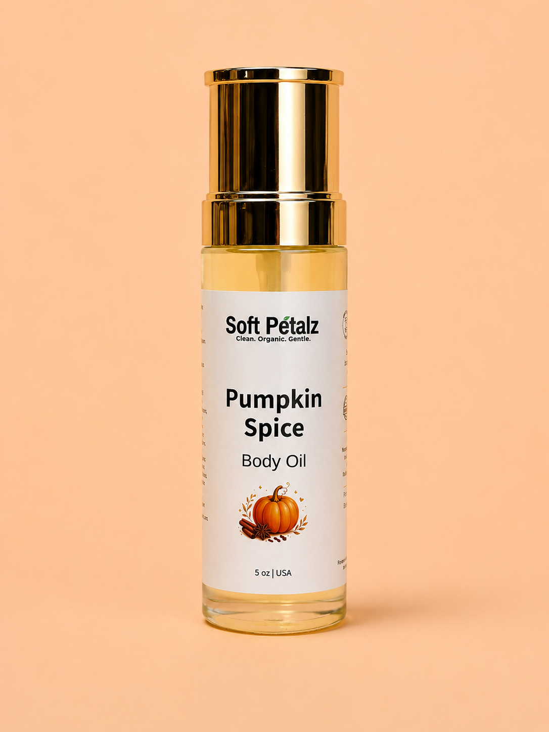 Bottle of Soft Pétalz Pumpkin Spice Body Oil on a peach background
